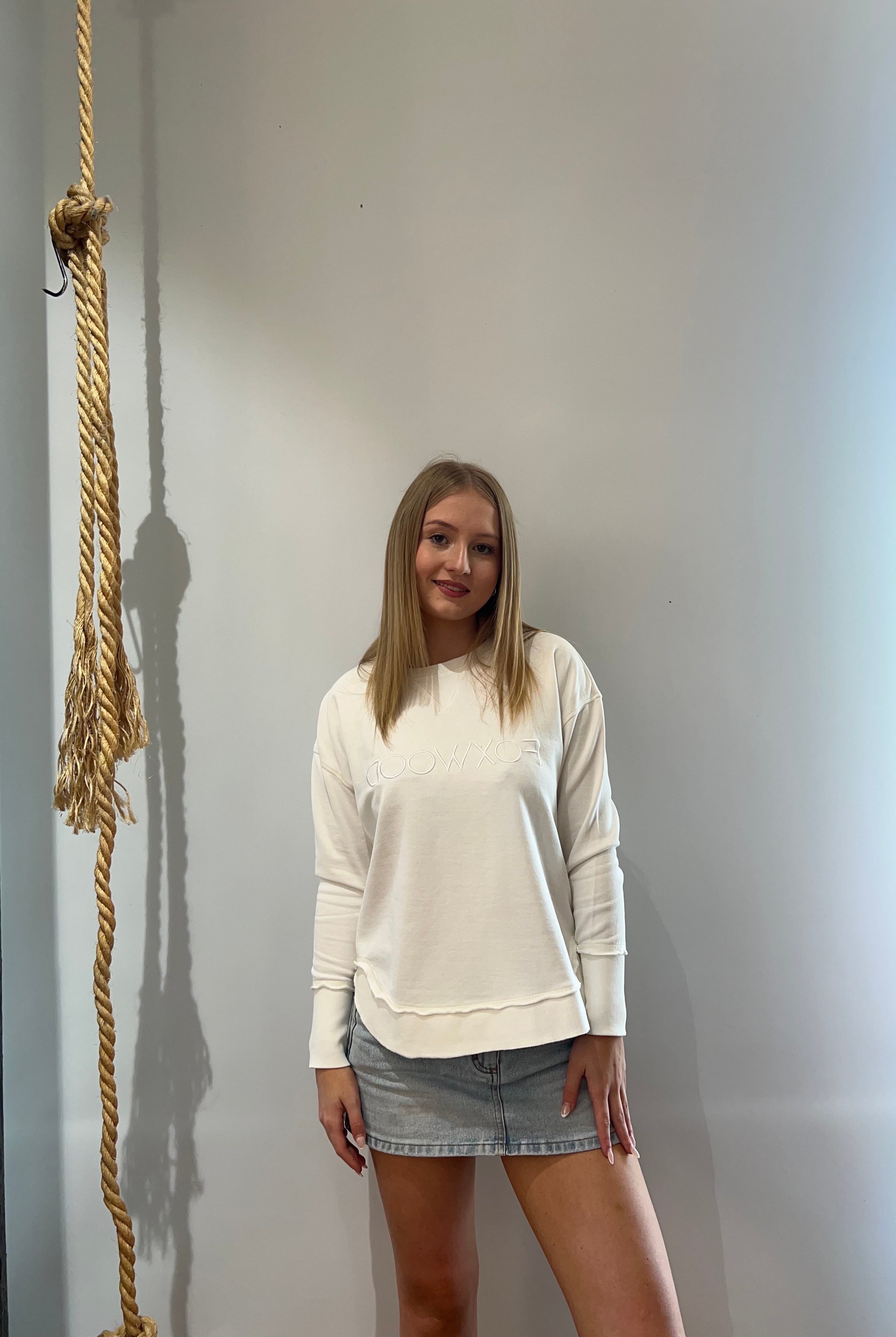 Foxwood Simplified Crew in Ecru featuring front chest embroidery, raw edge detailing, a curved hem and soft 100% cotton fabric.