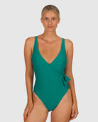 A woman modelling the Rococco D-DD Cup Surplice One Piece Swimming Costume in Jungle