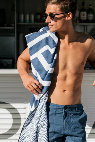 The Ultimate Beach Towel - The Surfers by Sky Gazer is available at Rawspice Boutique.