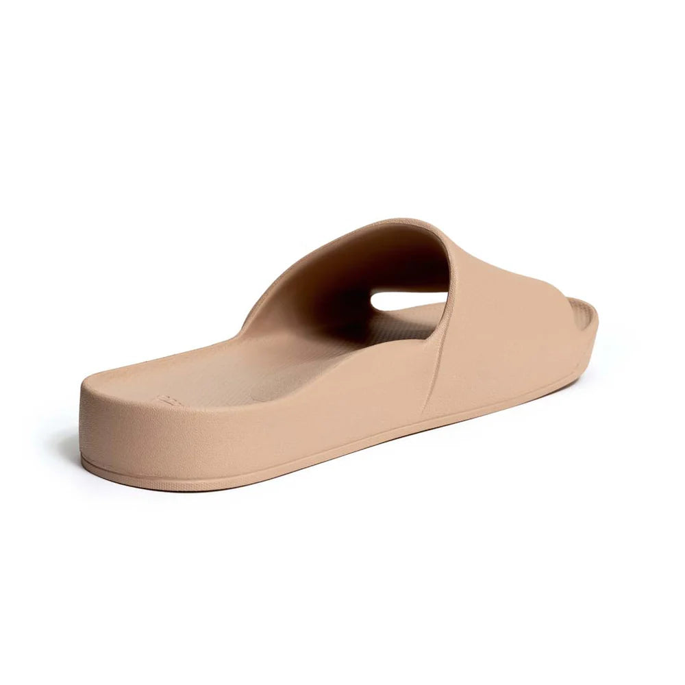 The Tan Arch Support Slides by Archies are available at Rawspice Boutique.