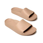 The Tan Arch Support Slides by Archies are available at Rawspice Boutique.