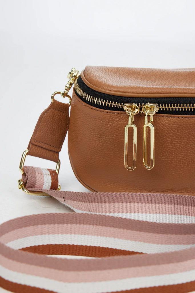 The Kensington Cross Body Bag - Tan + Stripe by Holiday is currently available from Rawspice Boutique.