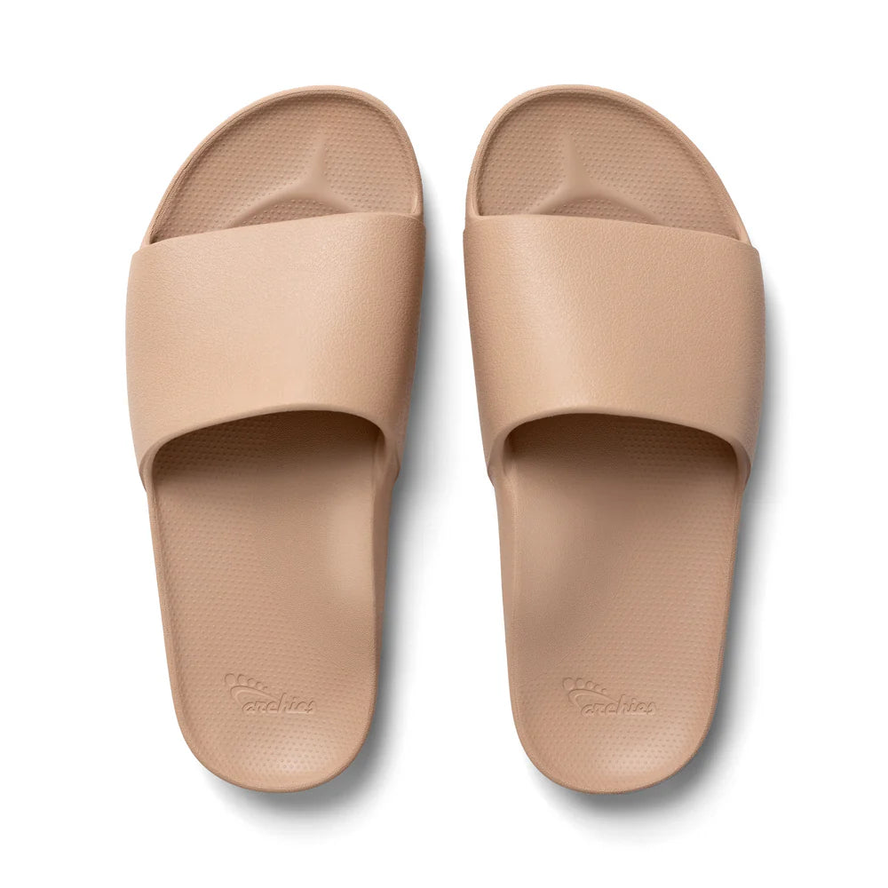 The Tan Arch Support Slides by Archies are available at Rawspice Boutique.