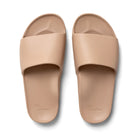 The Tan Arch Support Slides by Archies are available at Rawspice Boutique.