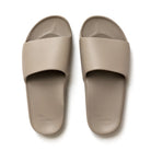 The Taupe Arch Support Slides by Archies are available at Rawspice Boutique.