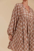 Mini linen-blend dress with a graceful V-neckline, voluminous sleeves, and a full hem, ideal for both warm-weather outings and layered cool-season looks.
