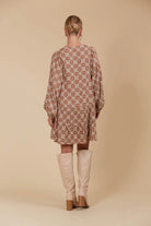 Mini linen-blend dress with a graceful V-neckline, voluminous sleeves, and a full hem, ideal for both warm-weather outings and layered cool-season looks.