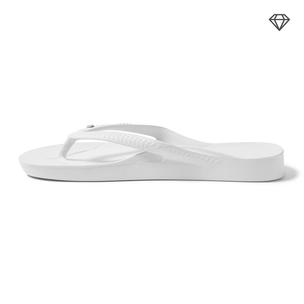 Crystal white arch support thongs with contoured footbeds and ergonomic straps for enhanced comfort and stability