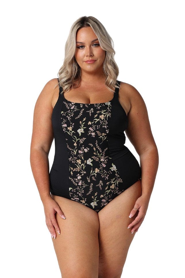 A woman modelling plus size swim wear in the Wildflowers Chlorine Resistant Tank One Piece