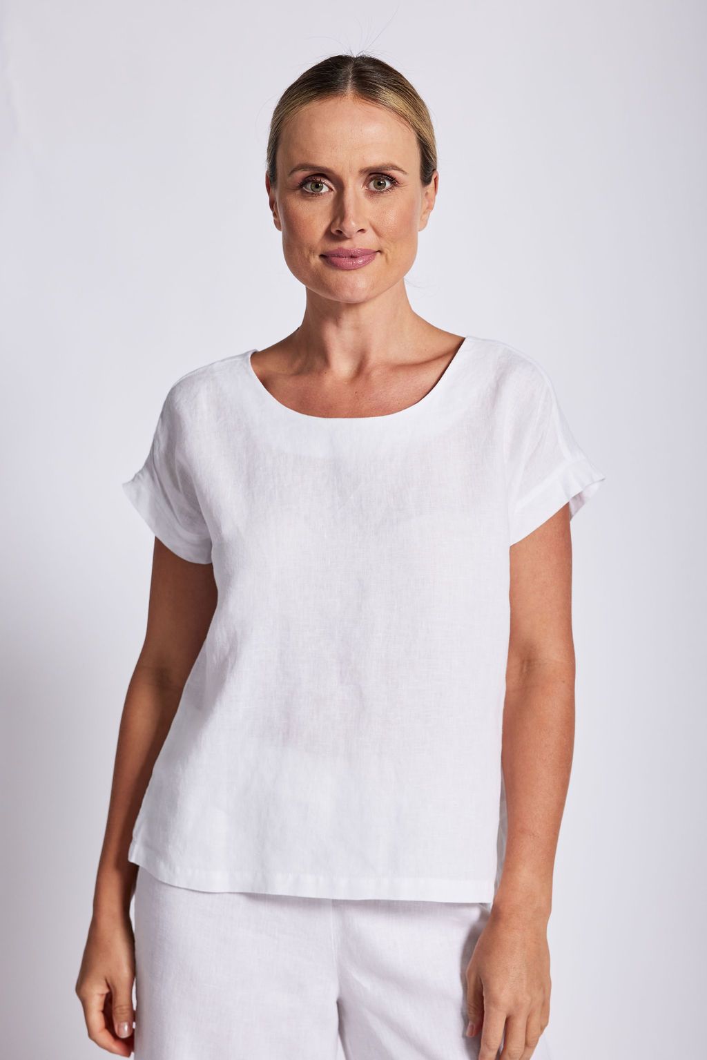 The White Cap Sleeve Button Back Top by See Saw is available at Rawspice Boutique.