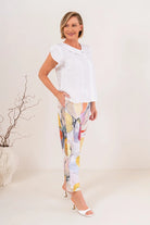2 Button Cowl Neck Linen Top featuring an asymmetric two-button neckline, flutter sleeves, centre pintuck detail and relaxed fit, available in white and sage.