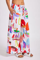 The Sailboat Print Wide Leg Drawstring Pants by See Saw are available at Rawspice Boutique.