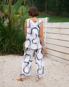 Palazzo linen pants featuring a relaxed wide-leg fit, high waist and shell button detailing down the side seam.