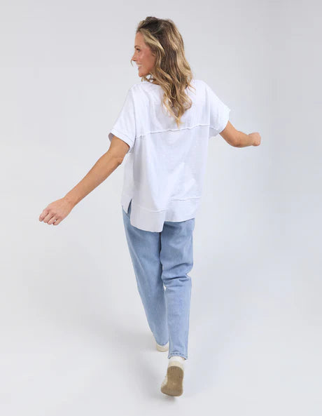 White 100% cotton Allison Tee with a relaxed fit, round neckline, design lines, and raw edge details, offering comfort and effortless style for everyday wear.