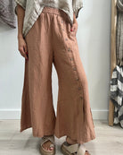 The Clay Bruna Button Wide Legged Pants by Rustic Linen are available at Rawspice Boutique. 