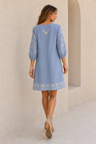 Feather Dress in soft chambray linen featuring floral embroidery, round neckline, relaxed 3/4 sleeves and an easy silhouette.