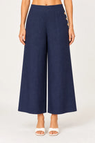Palazzo linen pants featuring a relaxed wide-leg fit, high waist and shell button detailing down the side seam.