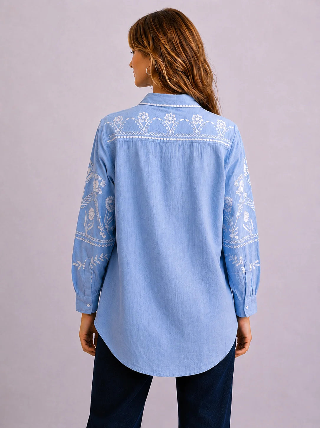 Feather Embroidery Shirt in soft chambray linen with hand-designed floral embroidery, classic collar and relaxed oversized fit.