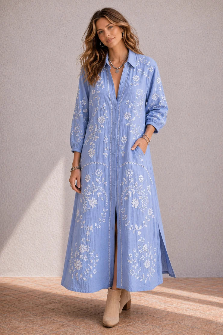 Feather Shirt Dress in soft chambray linen with floral embroidery, button-through front, ankle-length silhouette and side splits.