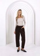 Relaxed and comfortable Leo Barrel Jeans in Chocolate, featuring a trendy barrel-leg fit, elastic drawstring waist, pockets and belt loops. 