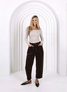 Relaxed and comfortable Leo Barrel Jeans in Chocolate, featuring a trendy barrel-leg fit, elastic drawstring waist, pockets and belt loops.