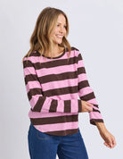 Yarn-dye stripe cotton slub jersey top with a curved hemline, lightweight feel, and relaxed fit ideal for layering.