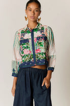 Roseanna bomber jacket in a multi-coloured patchwork-inspired floral print with a broderie basecloth.
