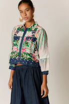Roseanna bomber jacket in a multi-coloured patchwork-inspired floral print with a broderie basecloth.
