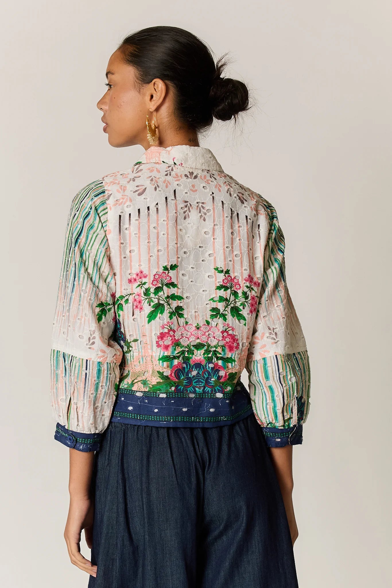 Roseanna bomber jacket in a multi-coloured patchwork-inspired floral print with a broderie basecloth.
