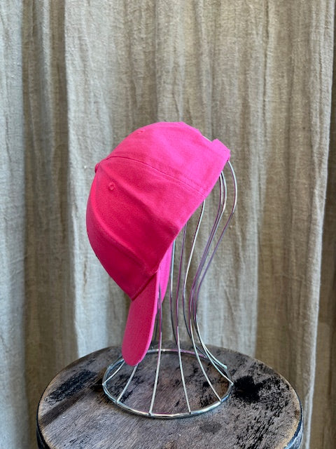 Smiley Cap in Pink with curved brim, adjustable back strap, and embroidered smiley face detail on the front.