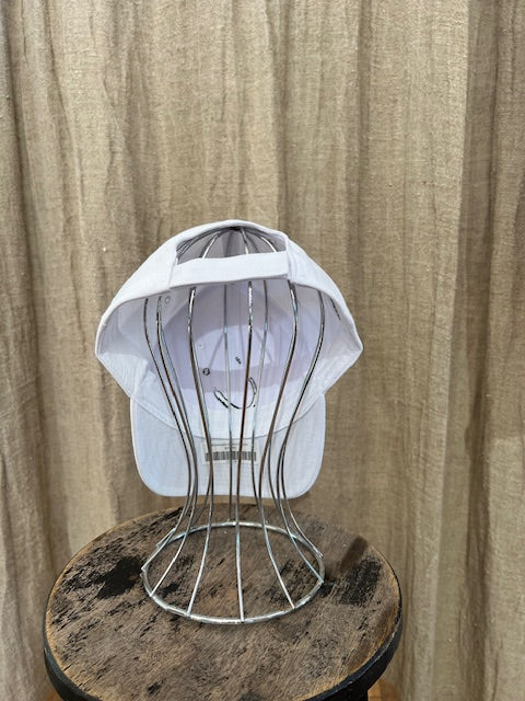 Smiley Cap in White with curved brim, adjustable back strap, and embroidered smiley face detail on the front.