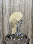 Smiley Cap in Beige with curved brim, adjustable back strap, and embroidered smiley face detail on the front.