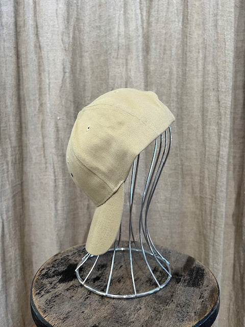 Smiley Cap in Beige with curved brim, adjustable back strap, and embroidered smiley face detail on the front.