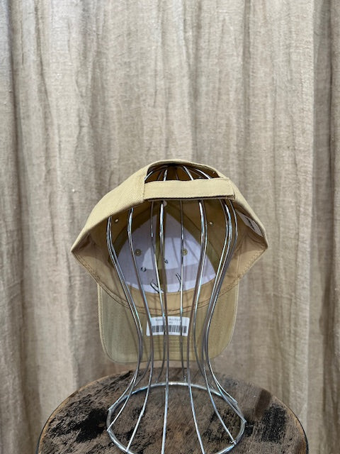 Smiley Cap in Beige with curved brim, adjustable back strap, and embroidered smiley face detail on the front.