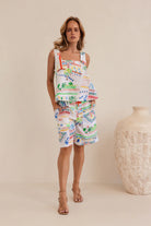 Vibrant Marrakesh print linen shorts with mid-thigh length, relaxed fit, two side pockets, and a tailored waistband with zip and hook closure.