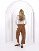 Model wearing relaxed-fit corduroy barrel jeans with a flattering silhouette, featuring front and back pockets for a modern, everyday look.