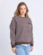 Model wearing the Original Stripe Crew, featuring yarn-dyed stripes, a relaxed fit, classic crew neckline, and a front chest pocket in a casual everyday style.