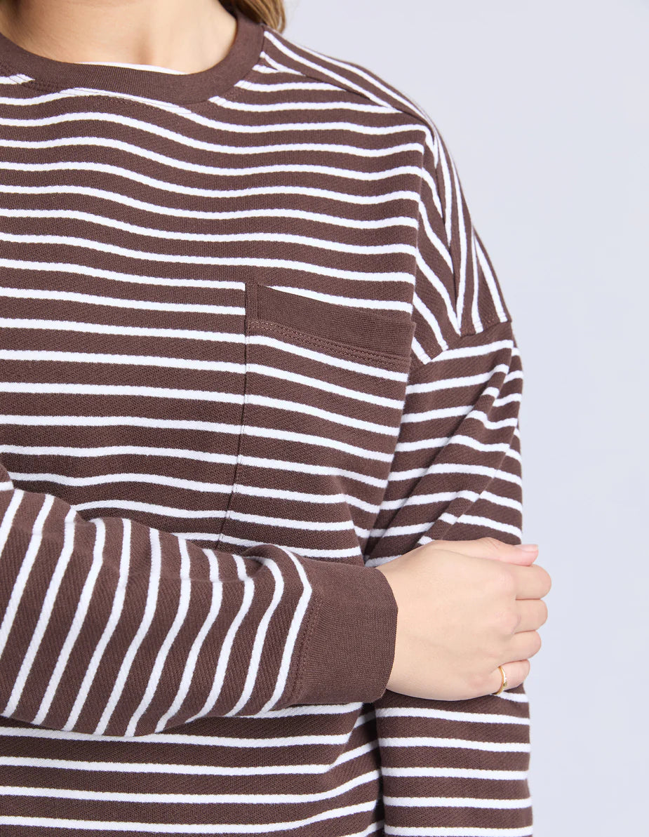 Model wearing the Original Stripe Crew, featuring yarn-dyed stripes, a relaxed fit, classic crew neckline, and a front chest pocket in a casual everyday style.