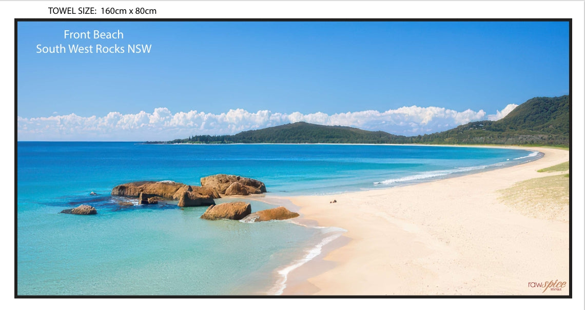 Beach towel featuring a photographic image of Front Beach, South West Rocks, with location text in the top corner and RawSpice logo in the bottom corner.
