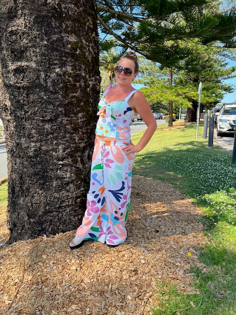 Boom Shankar Harper Pant in Sorrento, lightweight cotton pant with a mid-rise elastic waistband, tapered leg, and bold blue and white geometric print.
