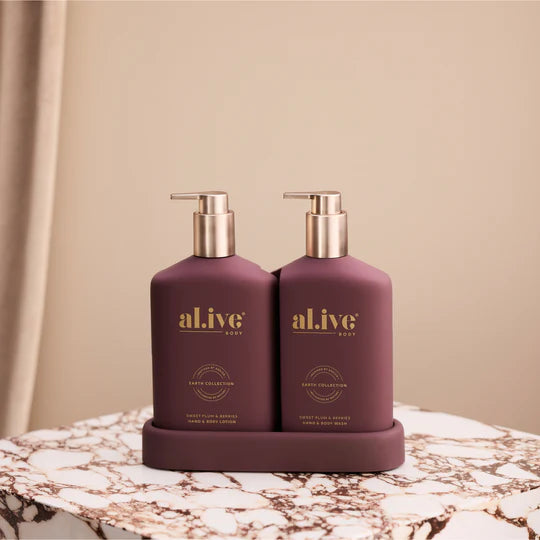 Transformative Duo – Sweet Plum & Berries featuring Wash and Lotion with interchangeable bronze and mulberry pumps, double-sided festive and classic bottles.
