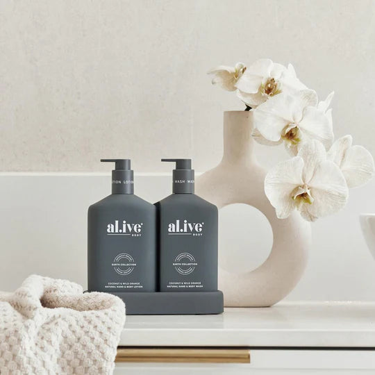 al.ive body Wash & Lotion Duo – Coconut & Wild Orange featuring 500ml hand & body wash, 500ml hand & body lotion, and matching tray in a sleek design.
