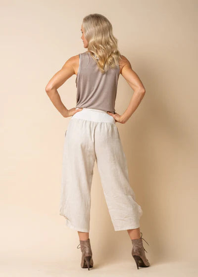 The Addison Linen Pant in Latte. Breathable linen trousers with a tie waist and side pockets, styled for relaxed, everyday elegance.