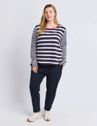 All Sorts Long Sleeve Top in Midnight/White with yarn-dyed stripes, an oversized fit, crew neckline and side splits.
