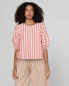 Boom Shankar Ava Top in Watermelon Stripe featuring coral and white stripes, elbow-length puff sleeves, a round neckline and cropped length.