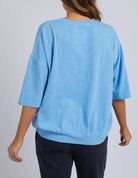 The Azure Blue Fundamental Mazie Sweat by Elm is available at Rawspice Boutique.