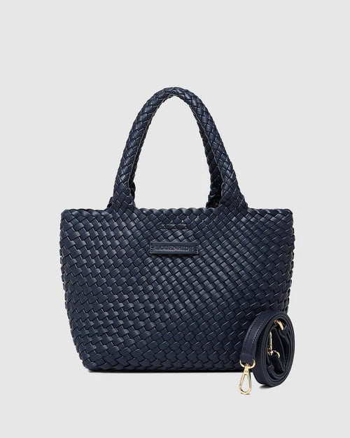 A stylish woven tote bag with top handles and an adjustable crossbody strap, perfect for effortless everyday elegance and versatility.