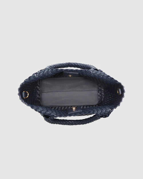 A stylish woven tote bag with top handles and an adjustable crossbody strap, perfect for effortless everyday elegance and versatility.