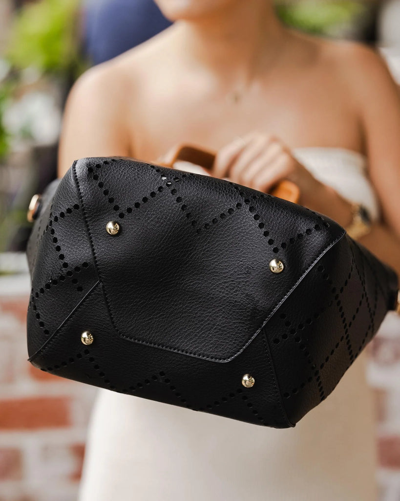 The Black Baby Bermuda Handbag by LOUENHIDE is currently available at Rawspice Boutique.