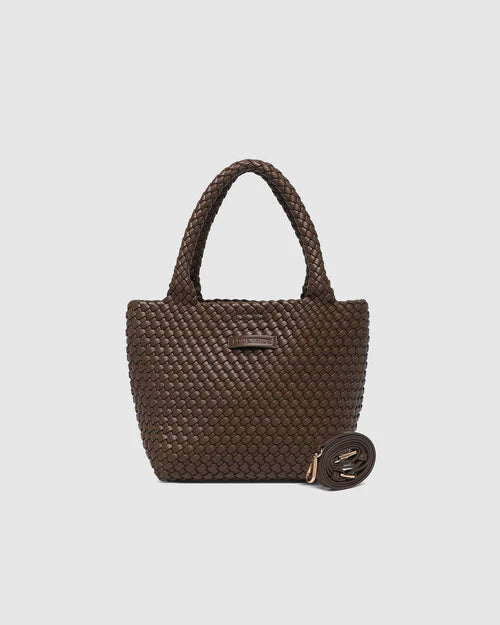 A stylish woven tote bag with top handles and an adjustable crossbody strap, perfect for effortless everyday elegance and versatility.